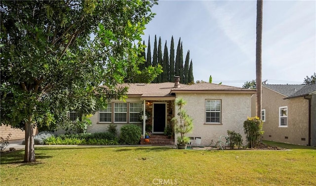 ranch-style house with a front yard