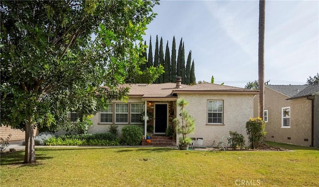 ranch-style home featuring a front yard