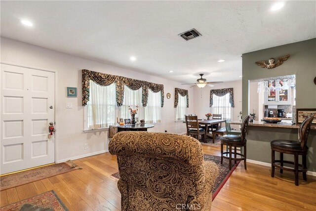 interior space featuring ceiling fan and light hardwood / wood-style floors