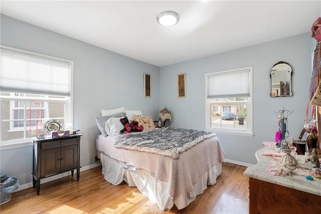 bedroom with light hardwood / wood-style floors