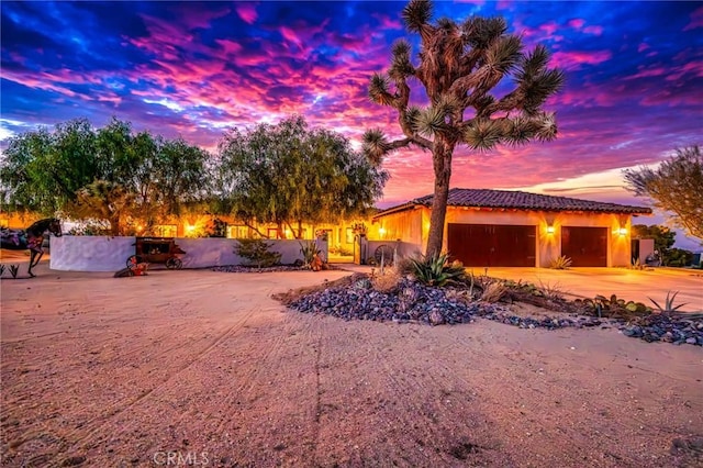 61138 Onaga Trl, Joshua Tree, CA 92252 - view of front of home with driveway, an attached garage, and a tiled roof