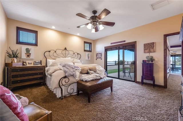 carpeted bedroom with multiple windows, access to exterior, and ceiling fan