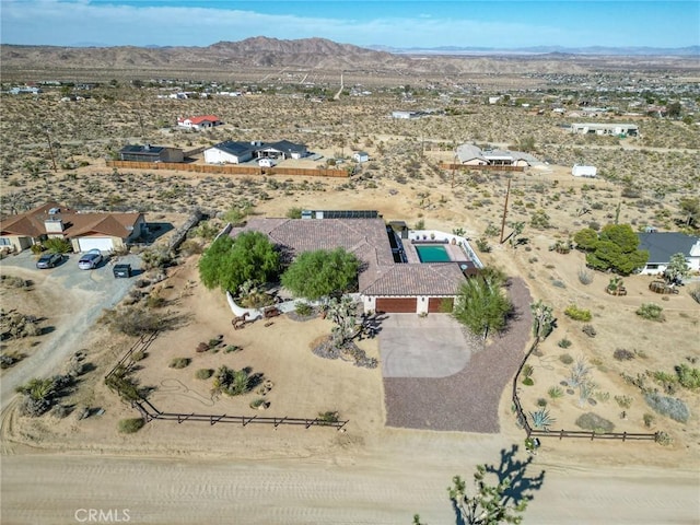 birds eye view of property featuring a mountain view