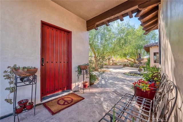 entrance to property with a patio