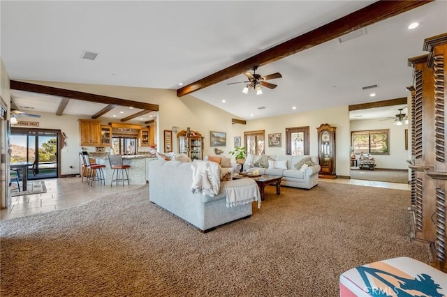 living room with vaulted ceiling with beams, light carpet, and ceiling fan