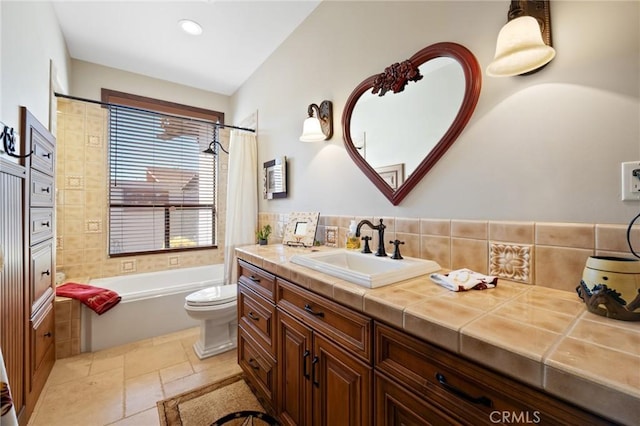 61138 Onaga Trl, Joshua Tree, CA 92252 - bathroom with vanity, backsplash, shower / bathtub combination with curtain, stone tile flooring, and recessed lighting