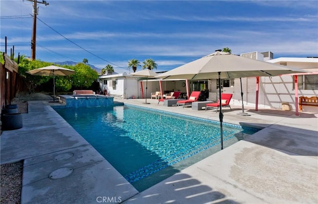 view of pool featuring an in ground hot tub and a patio area