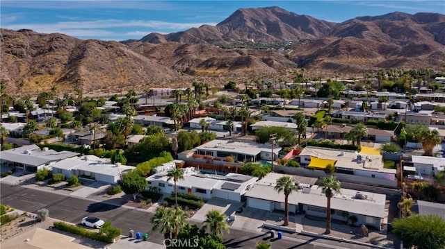 birds eye view of property featuring a mountain view