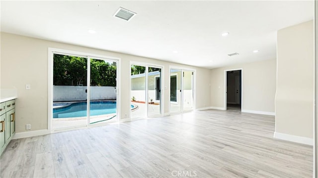 spare room featuring light hardwood / wood-style floors