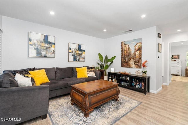 living room with light hardwood / wood-style flooring