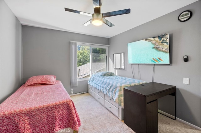 bedroom with ceiling fan and light colored carpet