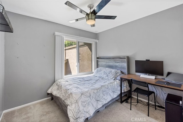 bedroom with ceiling fan and light carpet