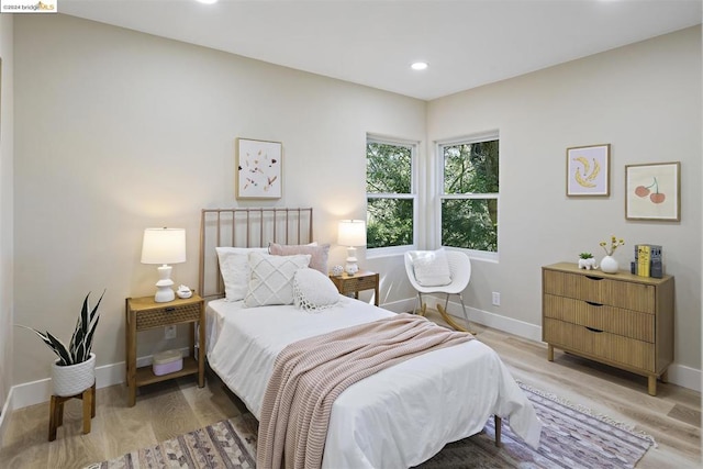 bedroom with light hardwood / wood-style flooring