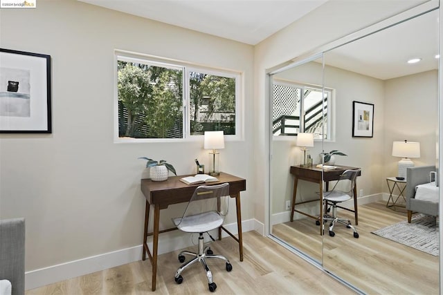 office space with light hardwood / wood-style floors