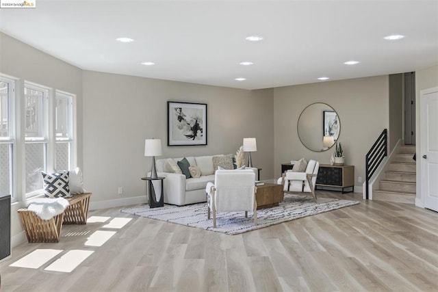 living room with a healthy amount of sunlight and light wood-type flooring