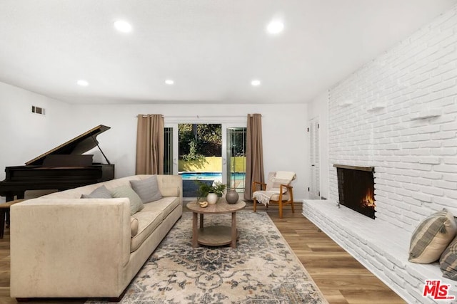 living room featuring a fireplace and hardwood / wood-style flooring