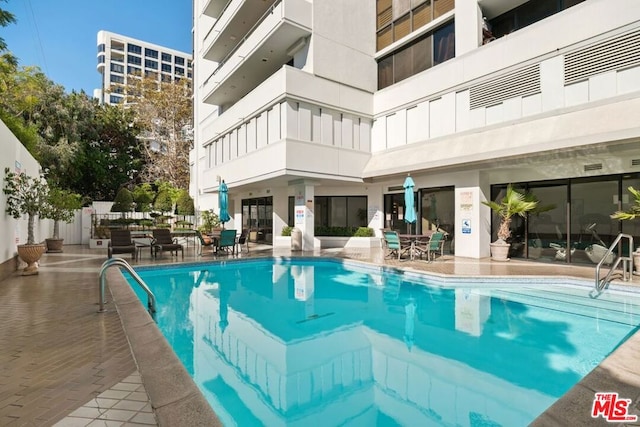 view of pool with a patio area