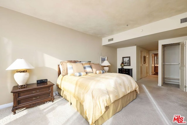 bedroom featuring light colored carpet