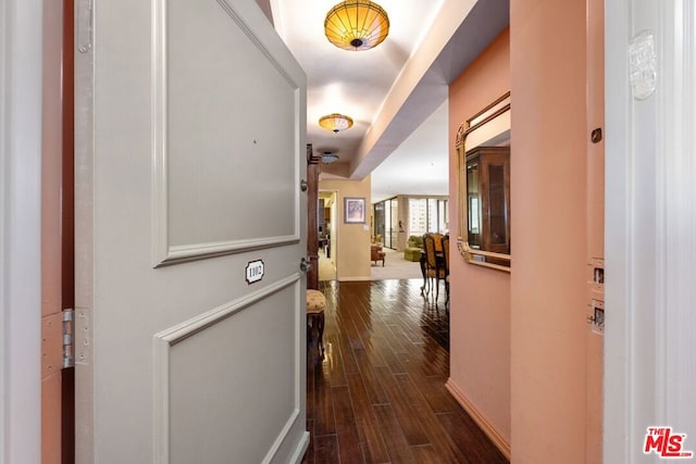 corridor featuring dark hardwood / wood-style flooring