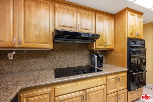 kitchen featuring black appliances, light tile patterned flooring, and backsplash