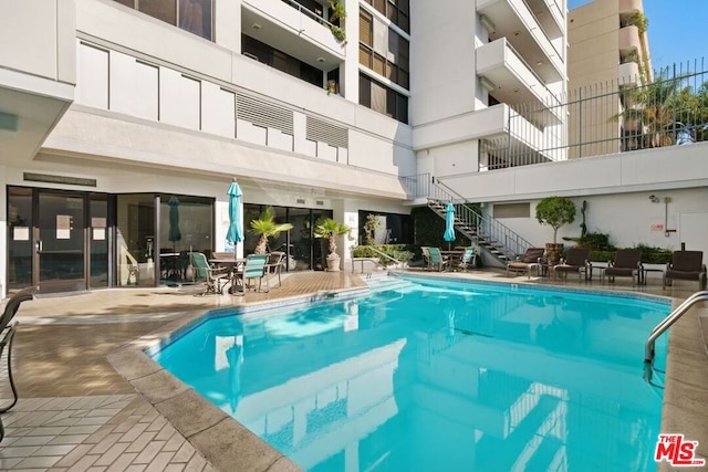 view of pool featuring a patio area