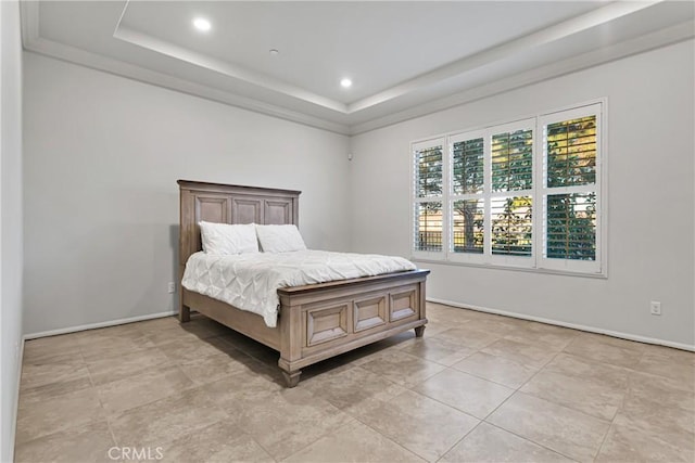 tiled bedroom with a tray ceiling