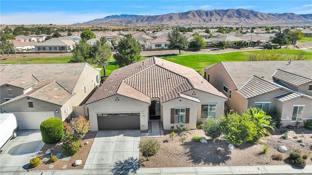 birds eye view of property featuring a mountain view