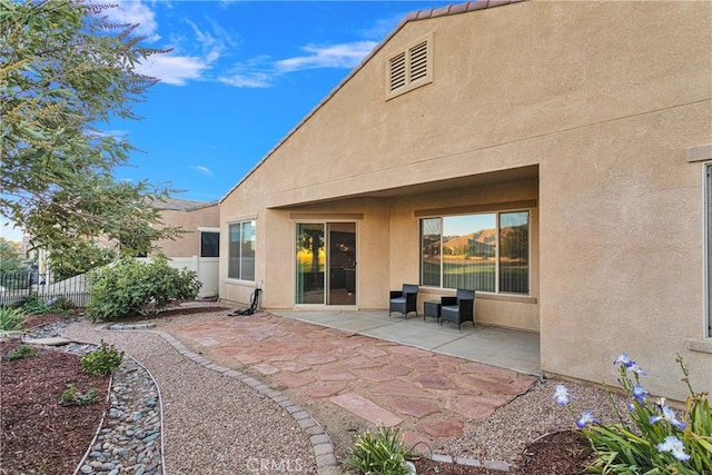 back of house with a patio area