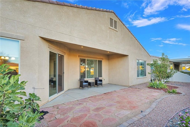 back of house featuring a patio area