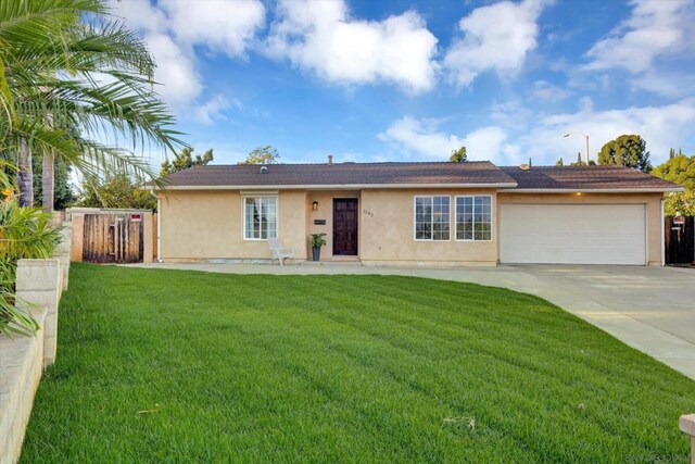 ranch-style house with a front yard and a garage