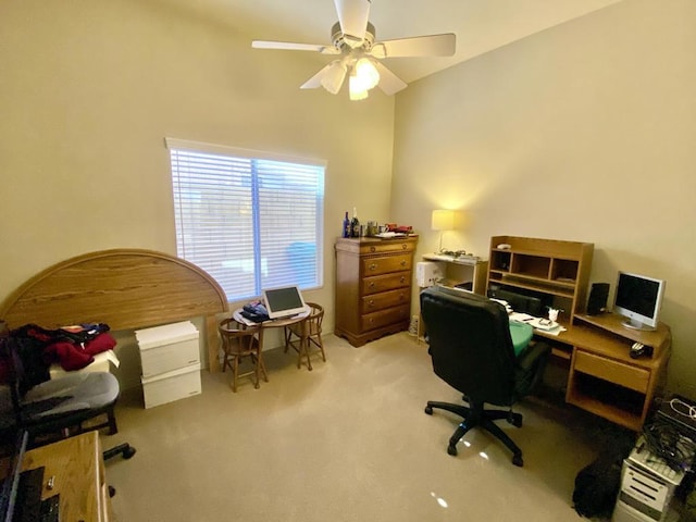 carpeted home office featuring ceiling fan