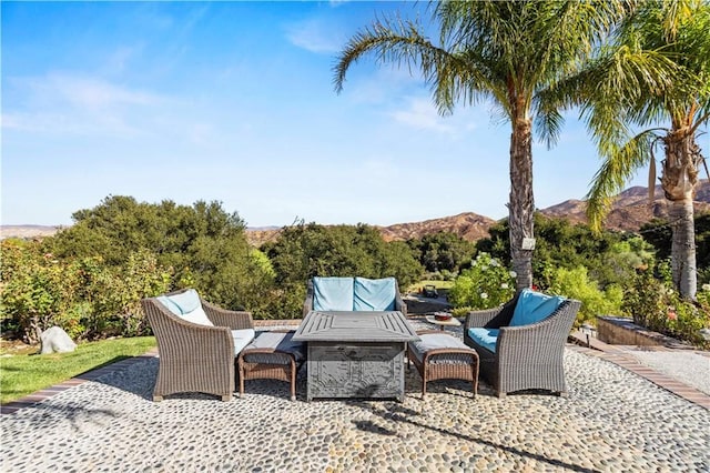 view of patio / terrace featuring a mountain view