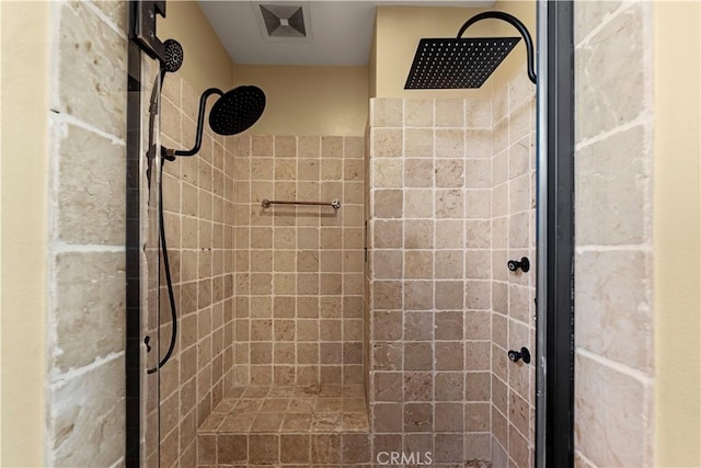 bathroom with tiled shower