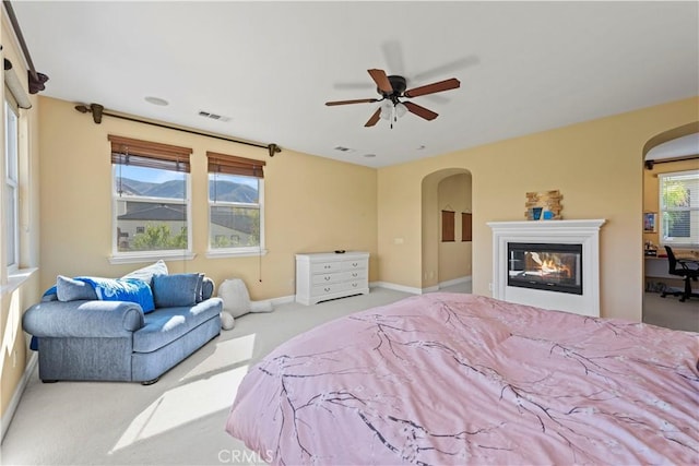 bedroom featuring ceiling fan and light carpet