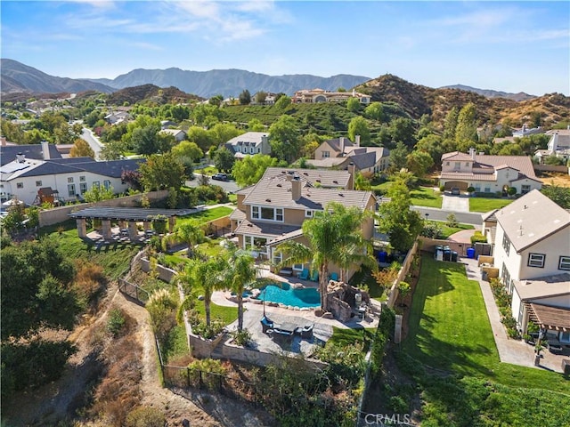 birds eye view of property with a mountain view