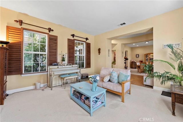 living room with light colored carpet