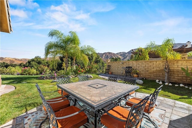 view of patio / terrace featuring a mountain view