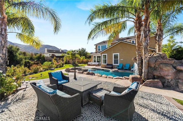 view of pool with a patio and an outdoor hangout area