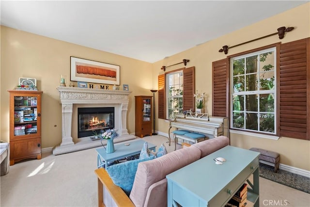 living room with a healthy amount of sunlight and light colored carpet