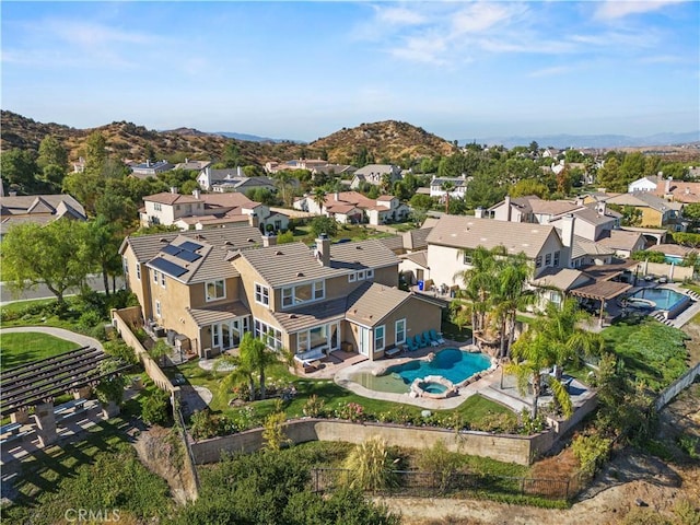 birds eye view of property featuring a mountain view