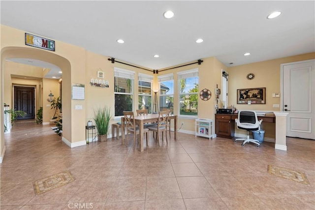 dining area with light tile patterned floors