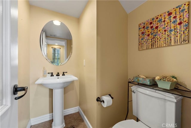 bathroom with toilet and sink