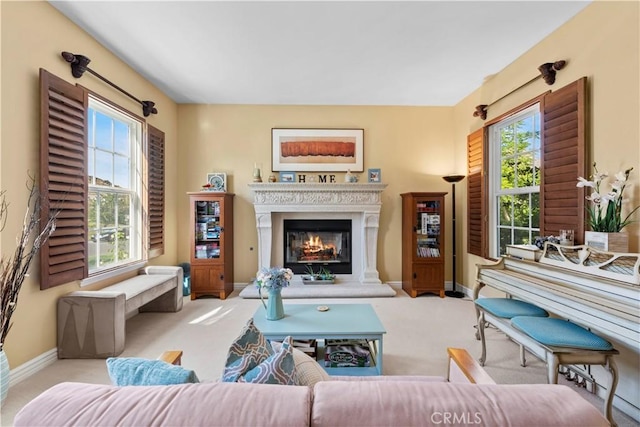 carpeted living room with a healthy amount of sunlight