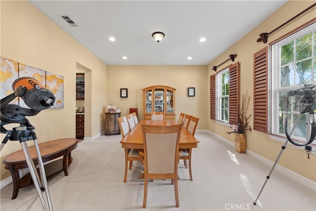 view of carpeted dining area