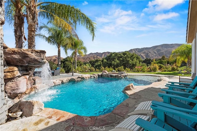 view of swimming pool featuring a mountain view and pool water feature