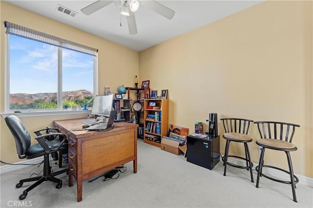 home office with ceiling fan and carpet floors