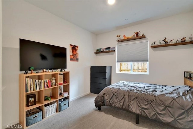 bedroom featuring light colored carpet