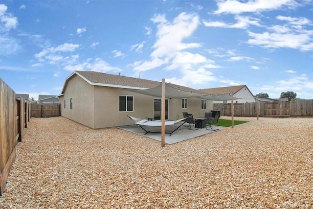 back of house featuring a patio area