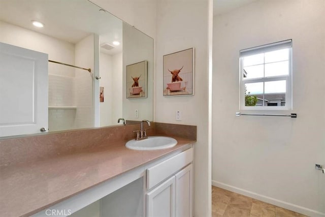 bathroom featuring vanity and walk in shower