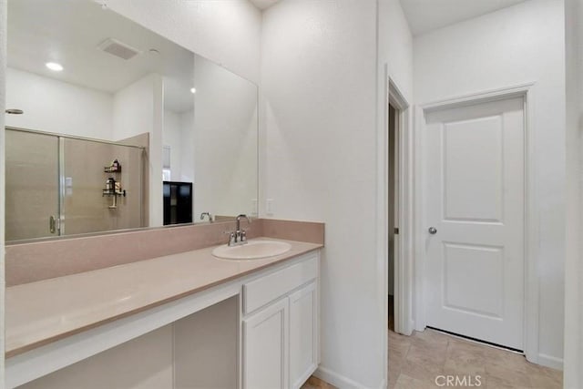 bathroom with vanity and an enclosed shower